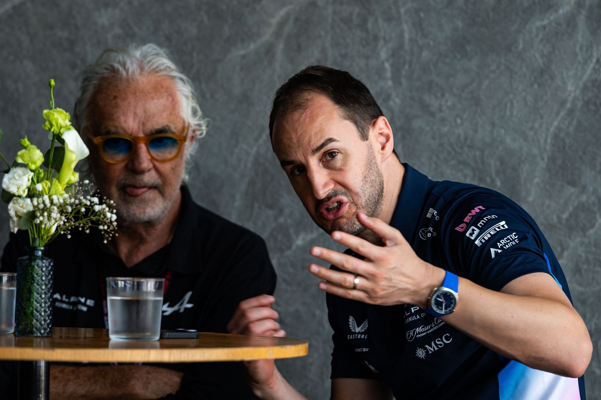 Alpine Team Principal Oliver Oakes speaks with Flavio Briatore in the Saudi Arabia hospitality suite. Source: Getty